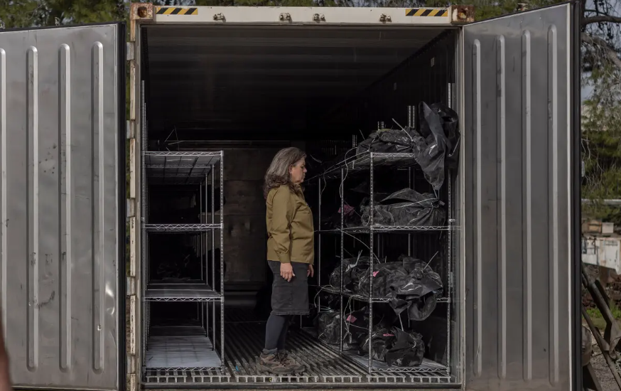 Shari Mendes, an architect who was called up as a reserve soldier to help handle the bodies of female troops, in a container used to hold bodies before their removal to a morgue at the Shura military base in central Israel.